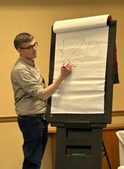 Aaron Finney adding a graph to a flipchart